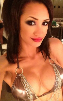 Halia Hill in golden bikini top with chains
