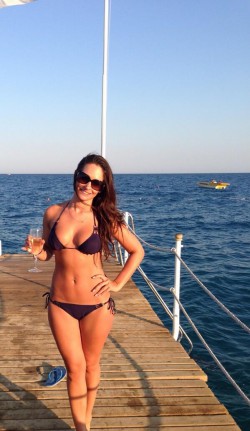 Anastasia Harris in purple bikini at the sea