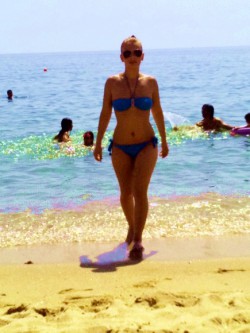 MFC’s Michelyy at beach in a blue bikini