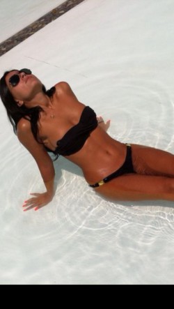 MFC’s MissHayfa in pool wearing black bikini