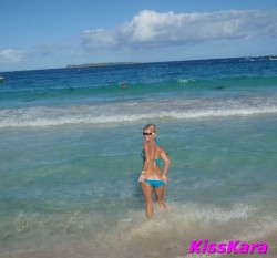 MFC KissKara in the ocean wearing blue bikini