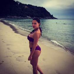 Aletta Ocean wearing purple bikini at the beach
